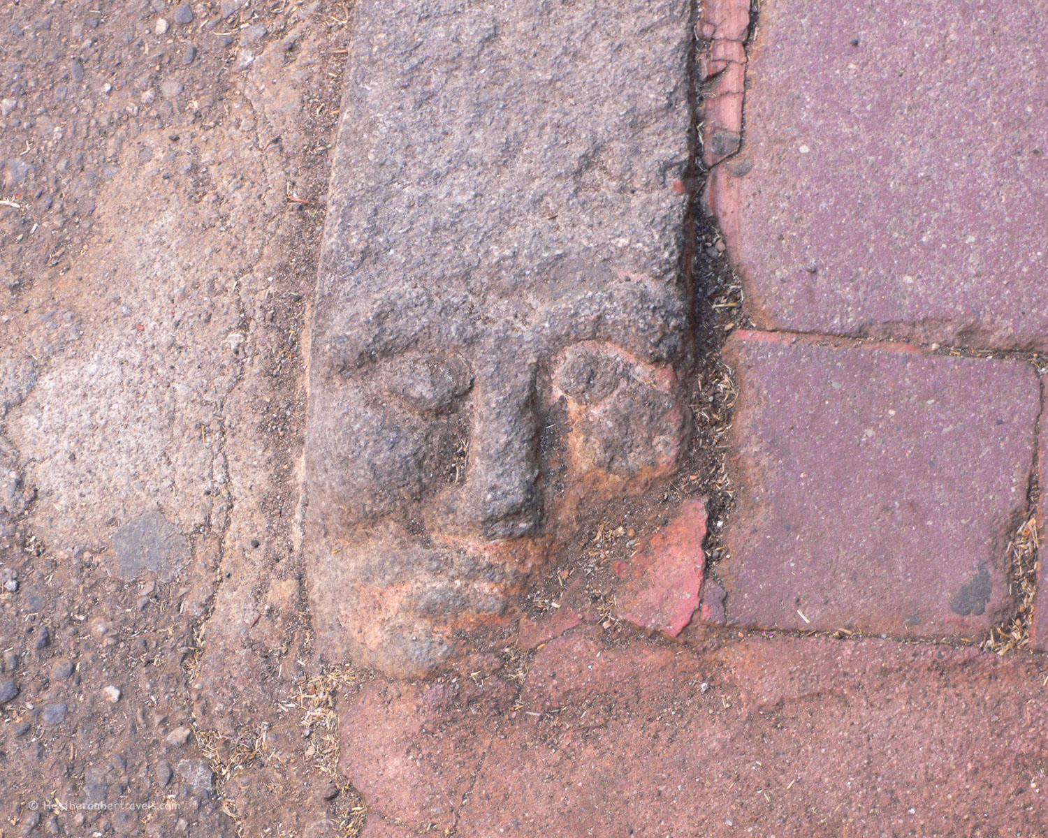 Carved faces kerb stones in Nuoro, Sardinia