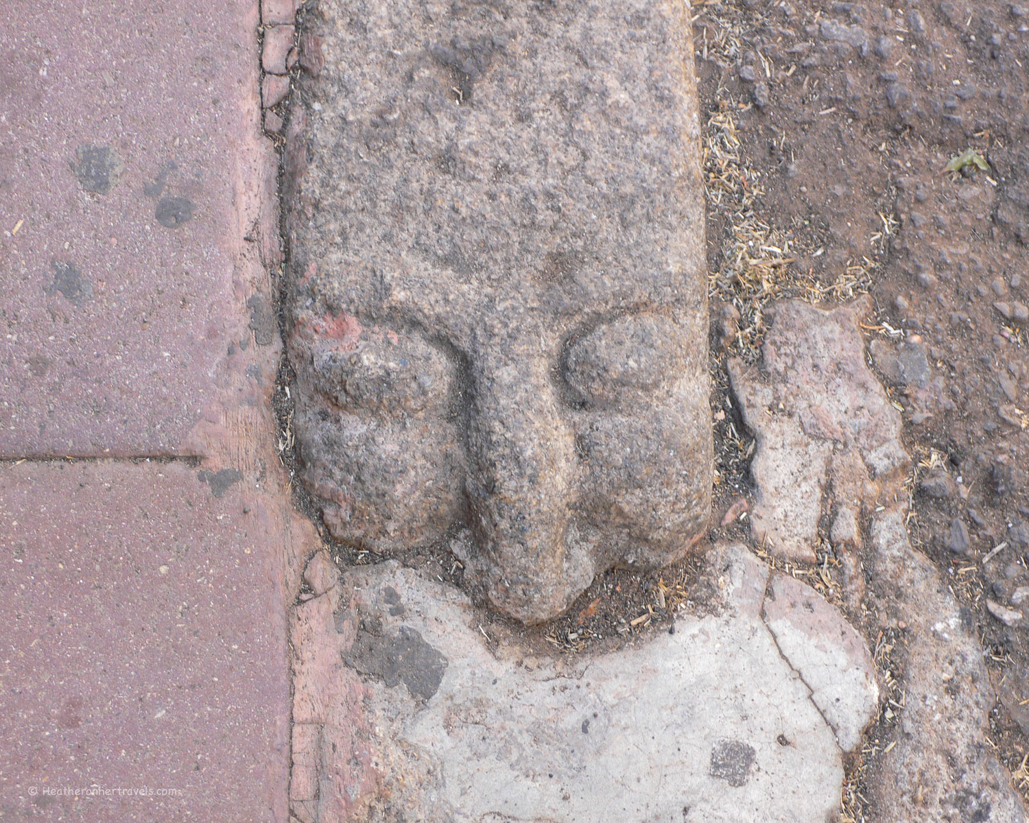 Carved faces kerb stones in Nuoro, Sardinia