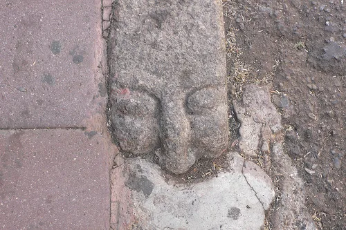 Carved faces kerb stones in Nuoro, Sardinia