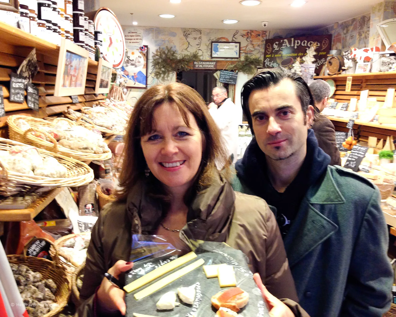 Heather and our Viator guide David in the Fromagerie at Marche d'Aligre
