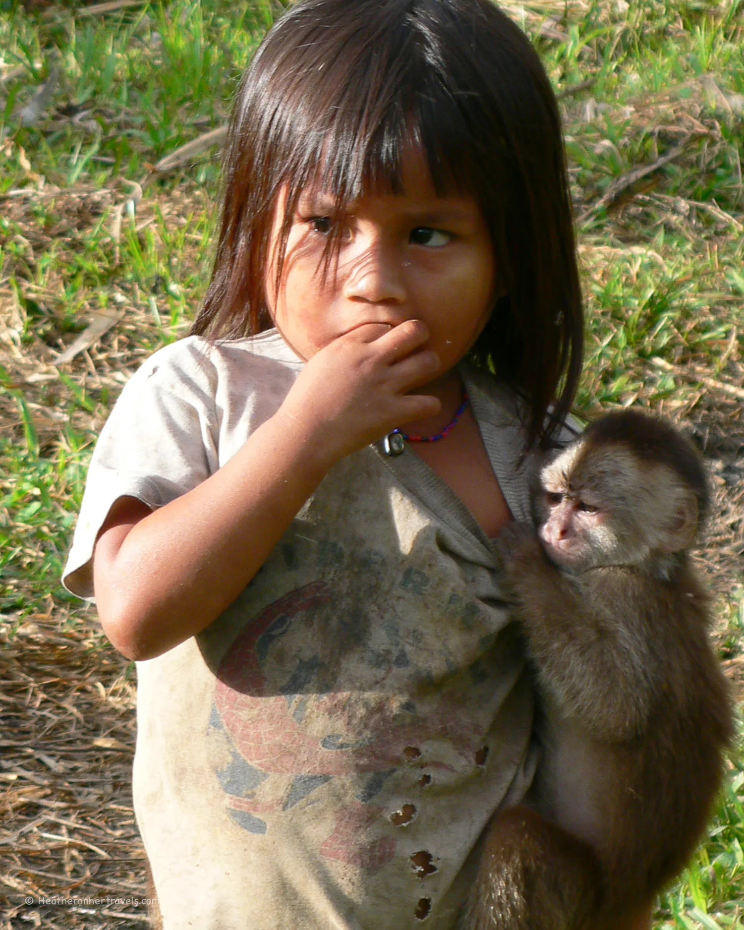 Girl with pet monkey in Ecuador