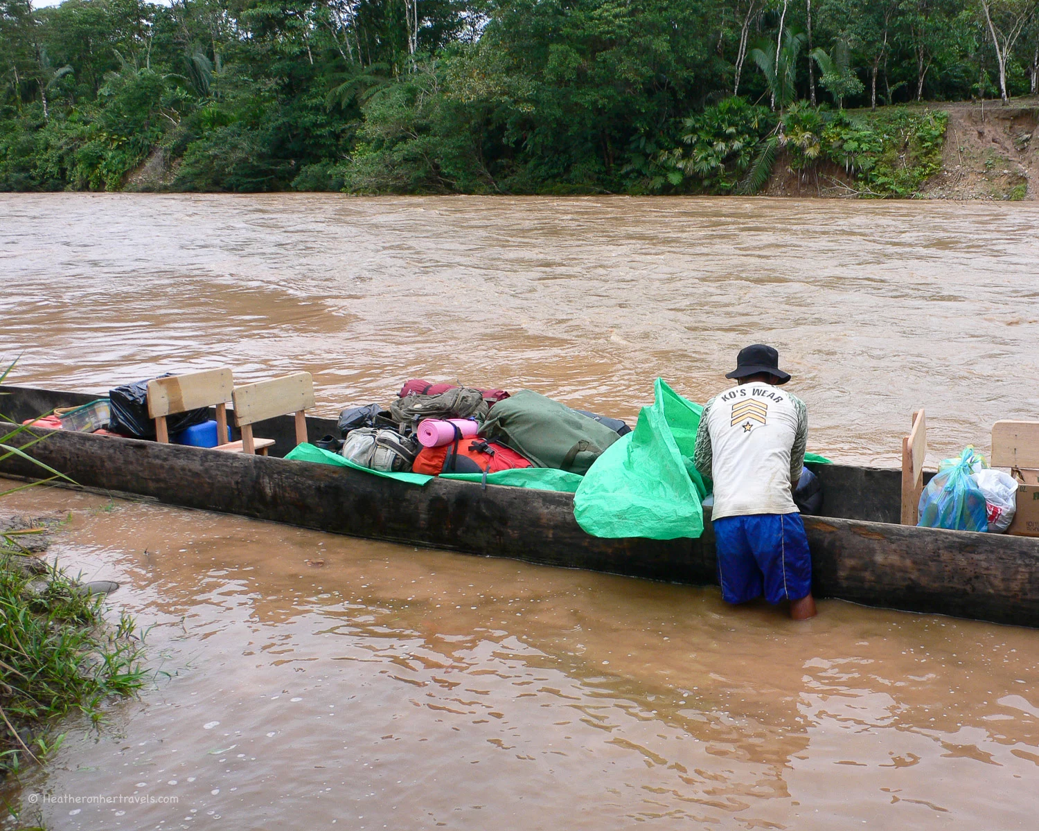 Loading the dug-out canoe - in Ecuador